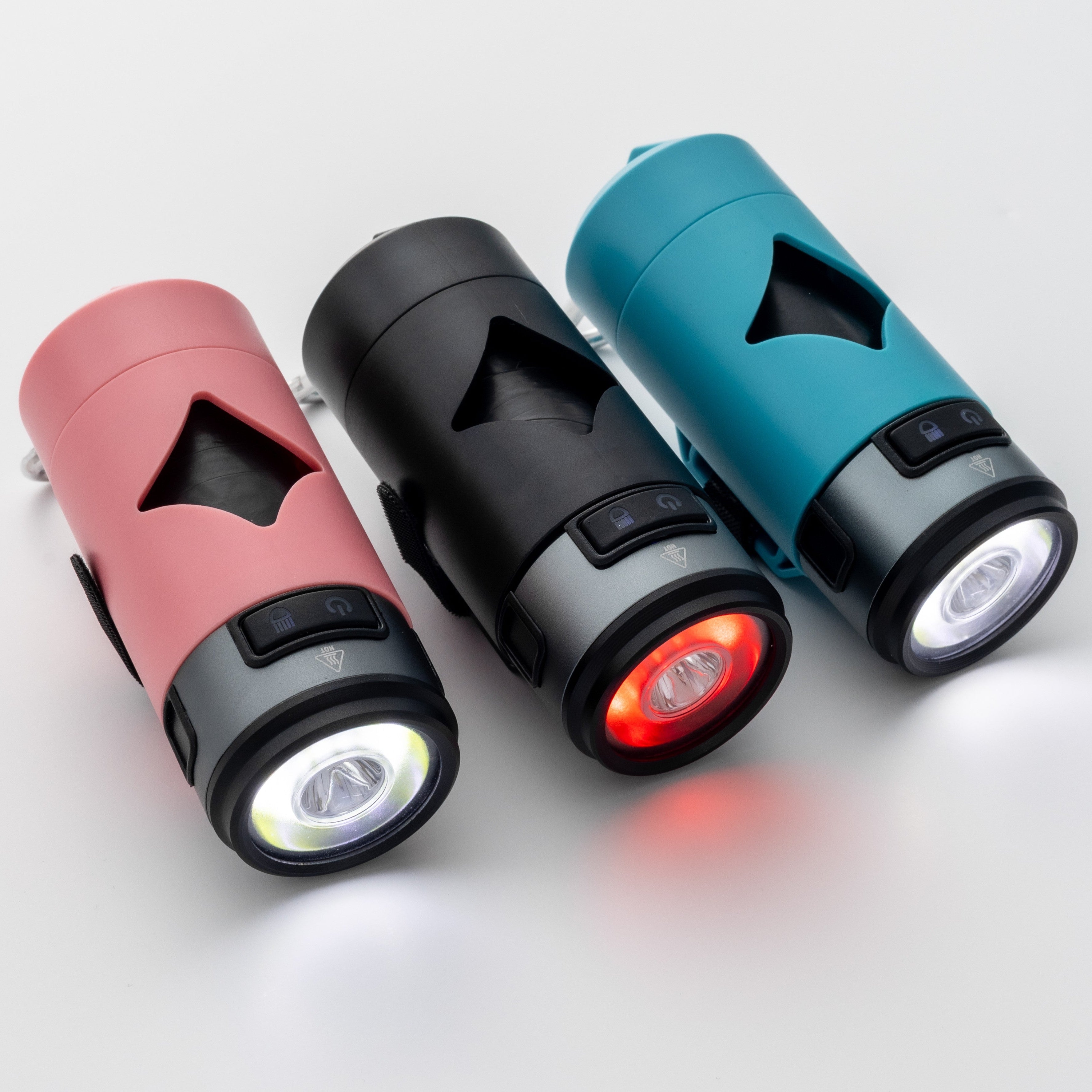 Three LED waste bag holders in pink, black, and blue on a light gray background