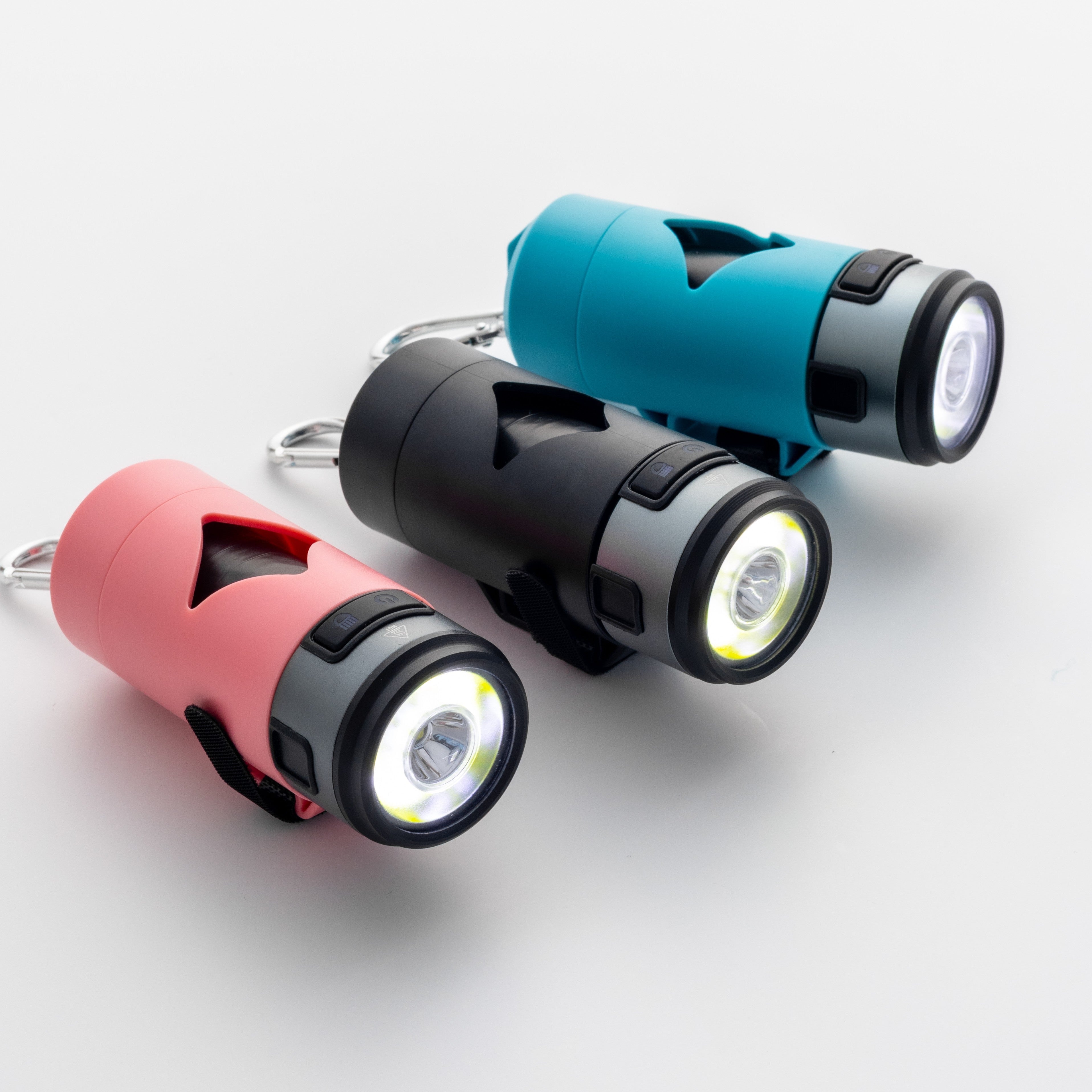 Three waste bag holder flashlights in red, black, and blue on a light gray background