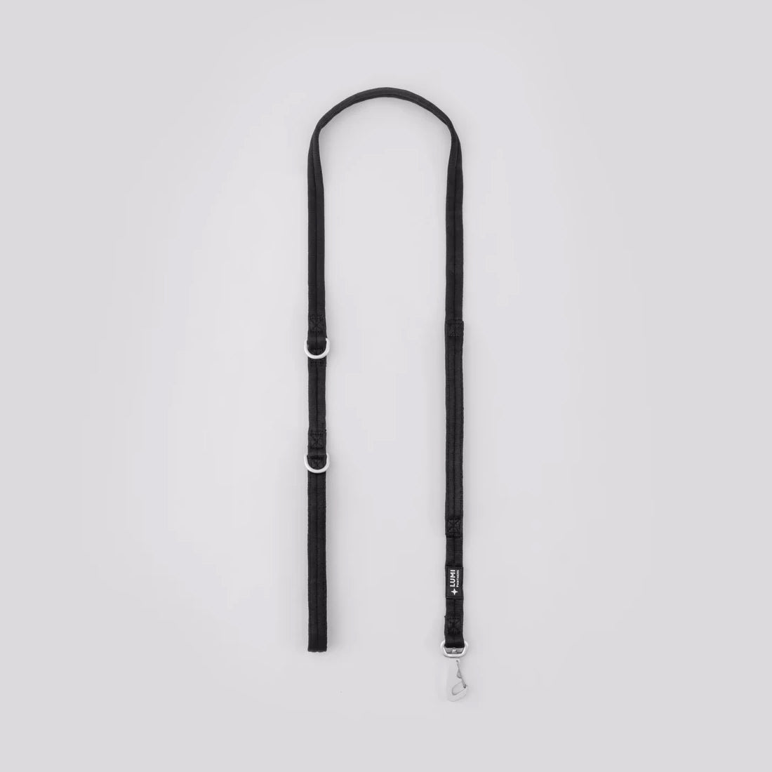 Black dog leash on a light gray background
